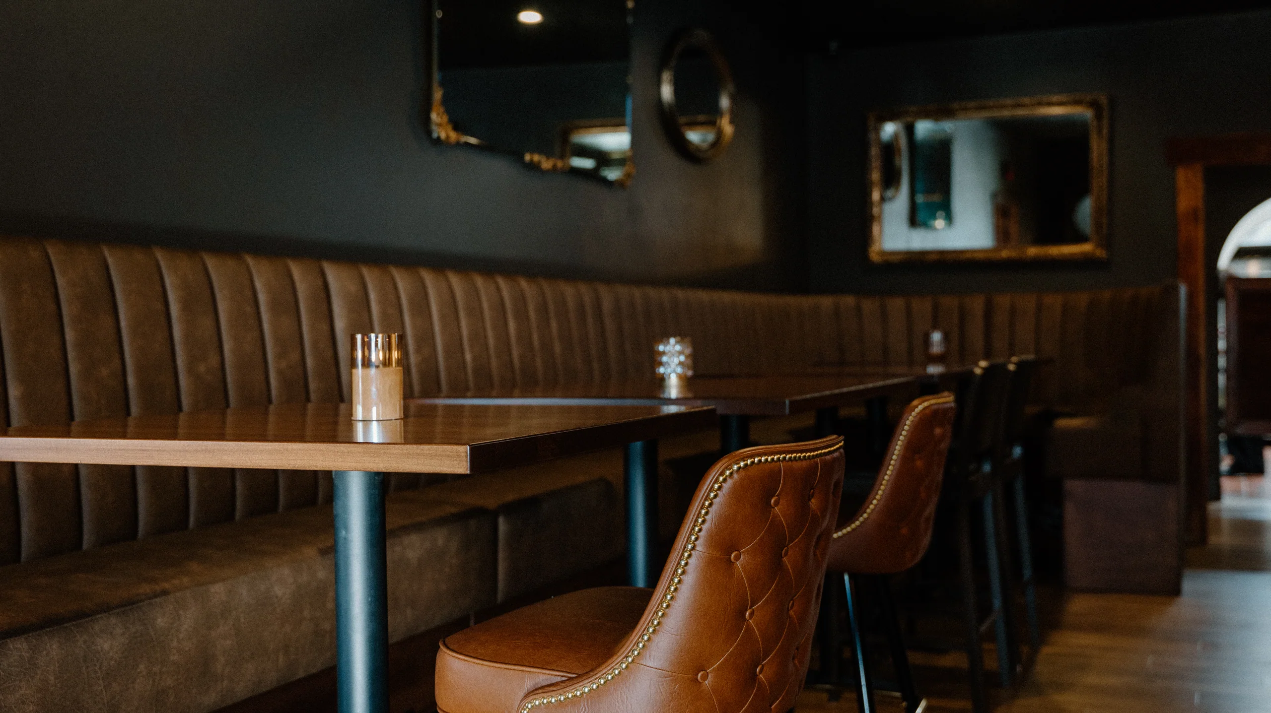 Booth seating and candlelight at SPUR